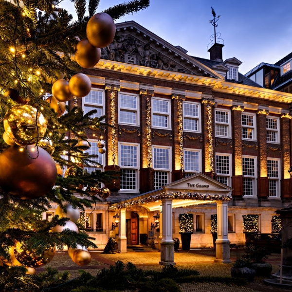 a building with a tree and lights