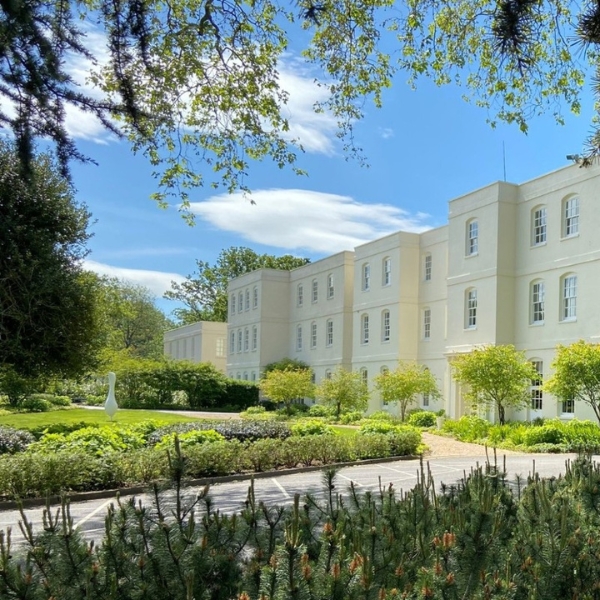 a building with trees and bushes