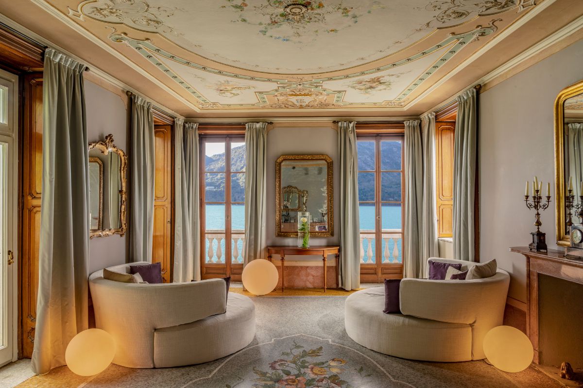 a room with a view of water and a mirror