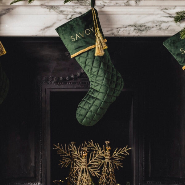 a green stocking from a fireplace