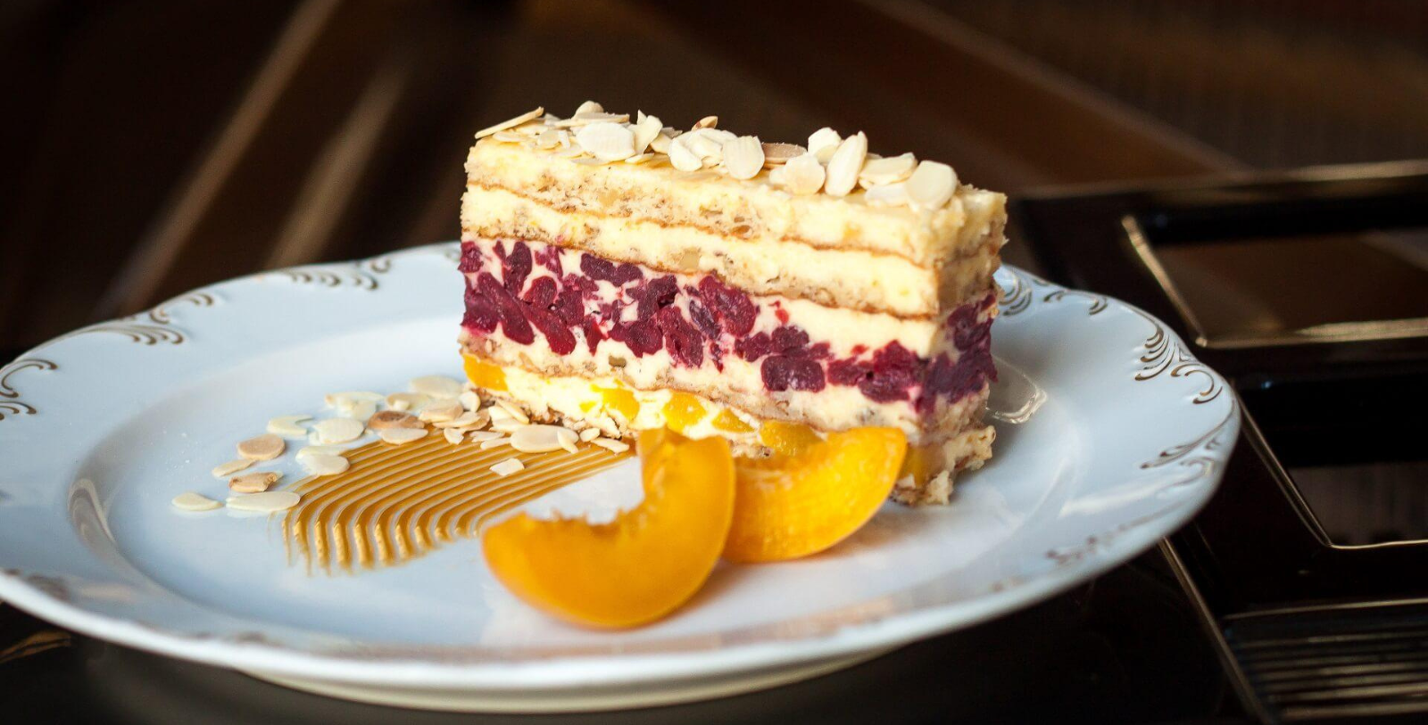a piece of cake with fruit on top