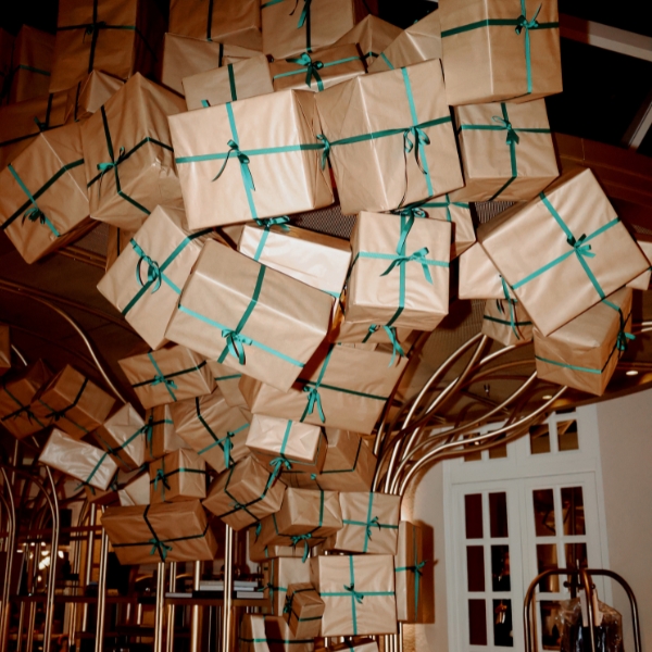 a group of boxes with green ribbons