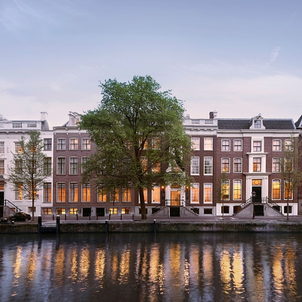 a row of buildings next to a body of water