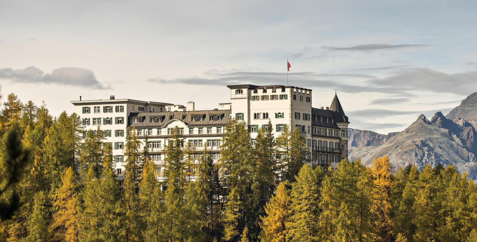 a large building with trees in the background 20