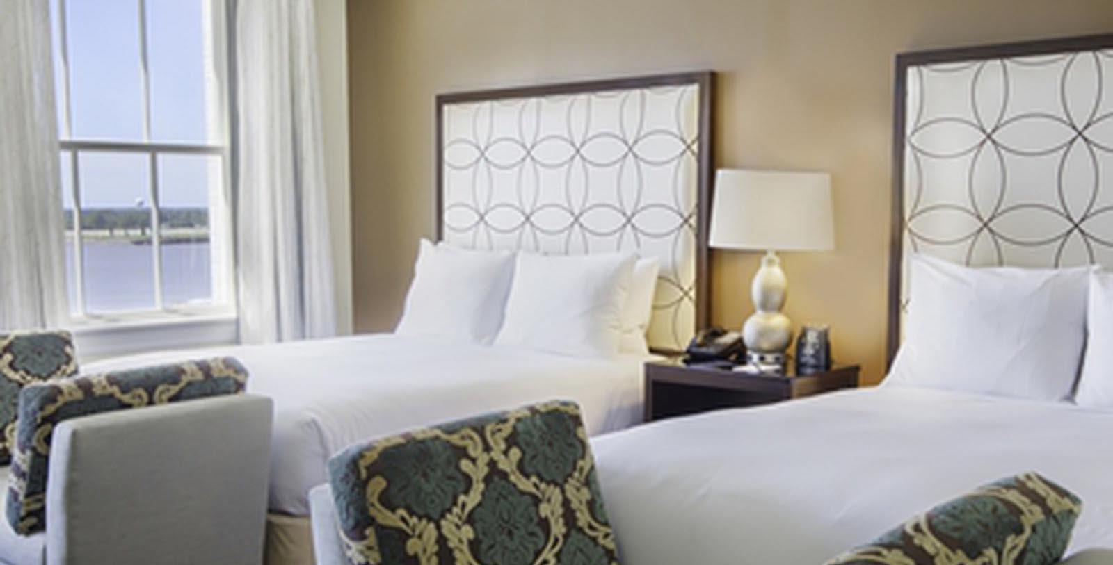 a hotel room with two beds