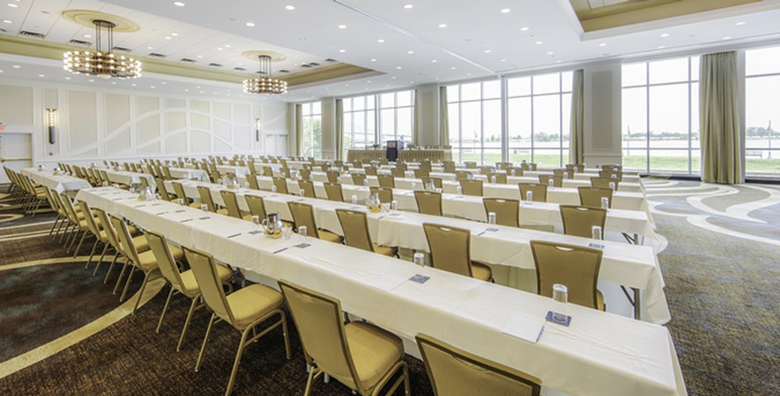 a room with long tables and chairs
