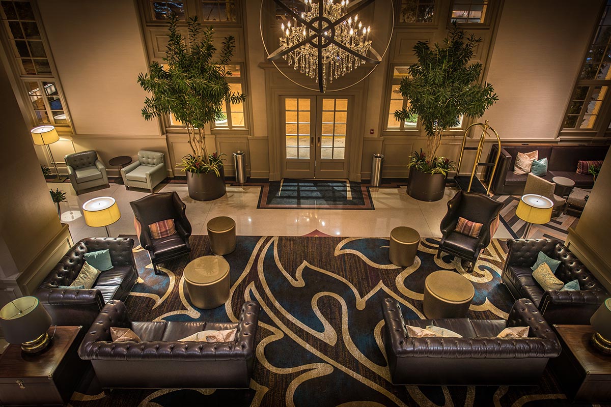 a room with a chandelier and chairs