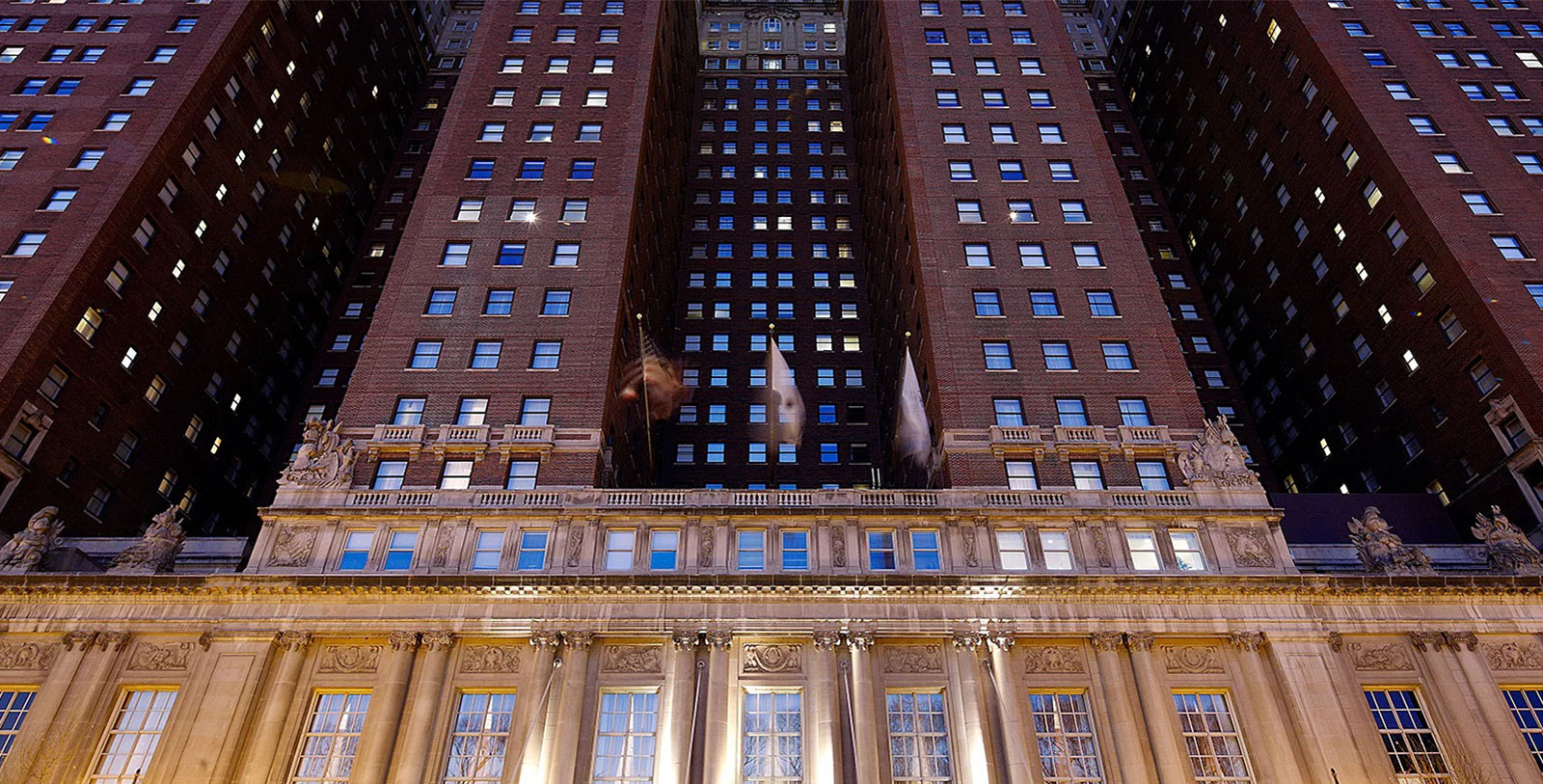 a tall building with flags