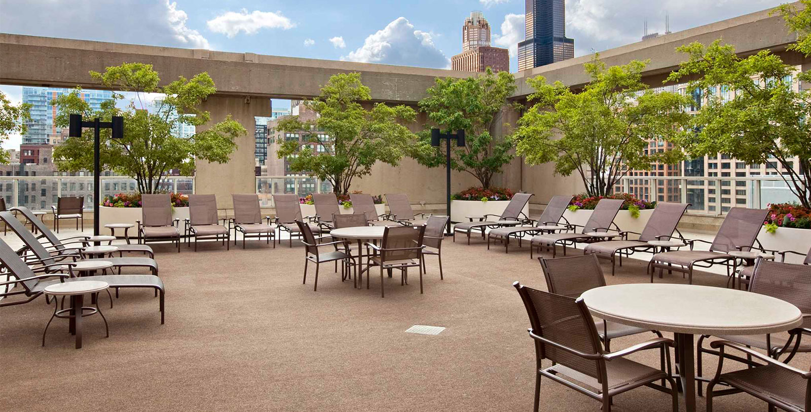 a patio with chairs and tables