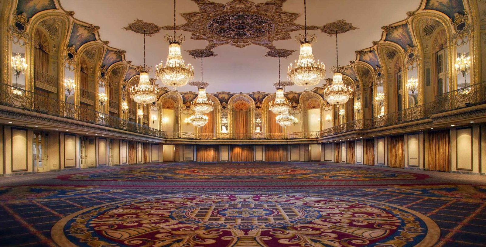 a large room with chandeliers from the ceiling