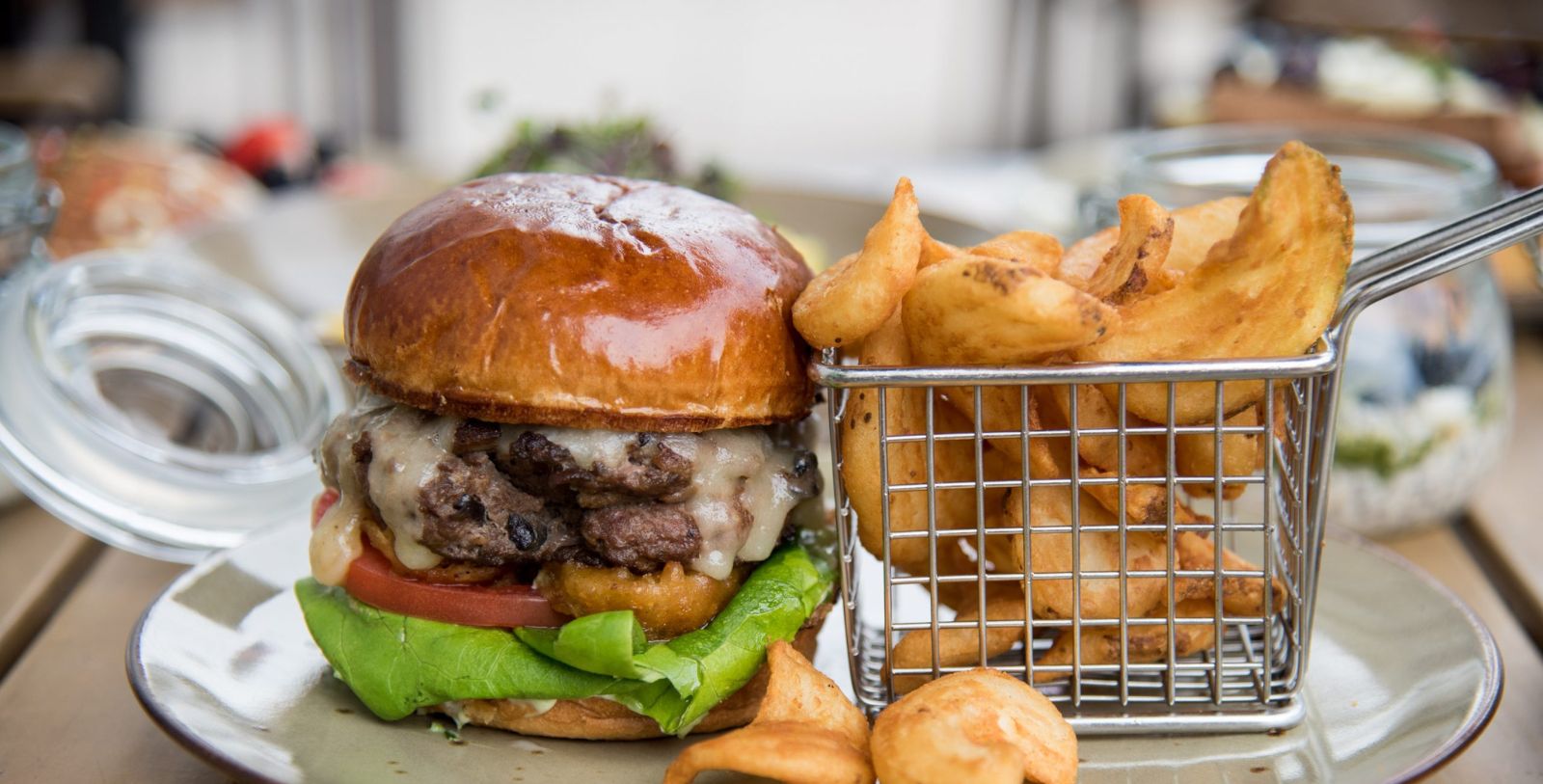 a burger and fries on a table