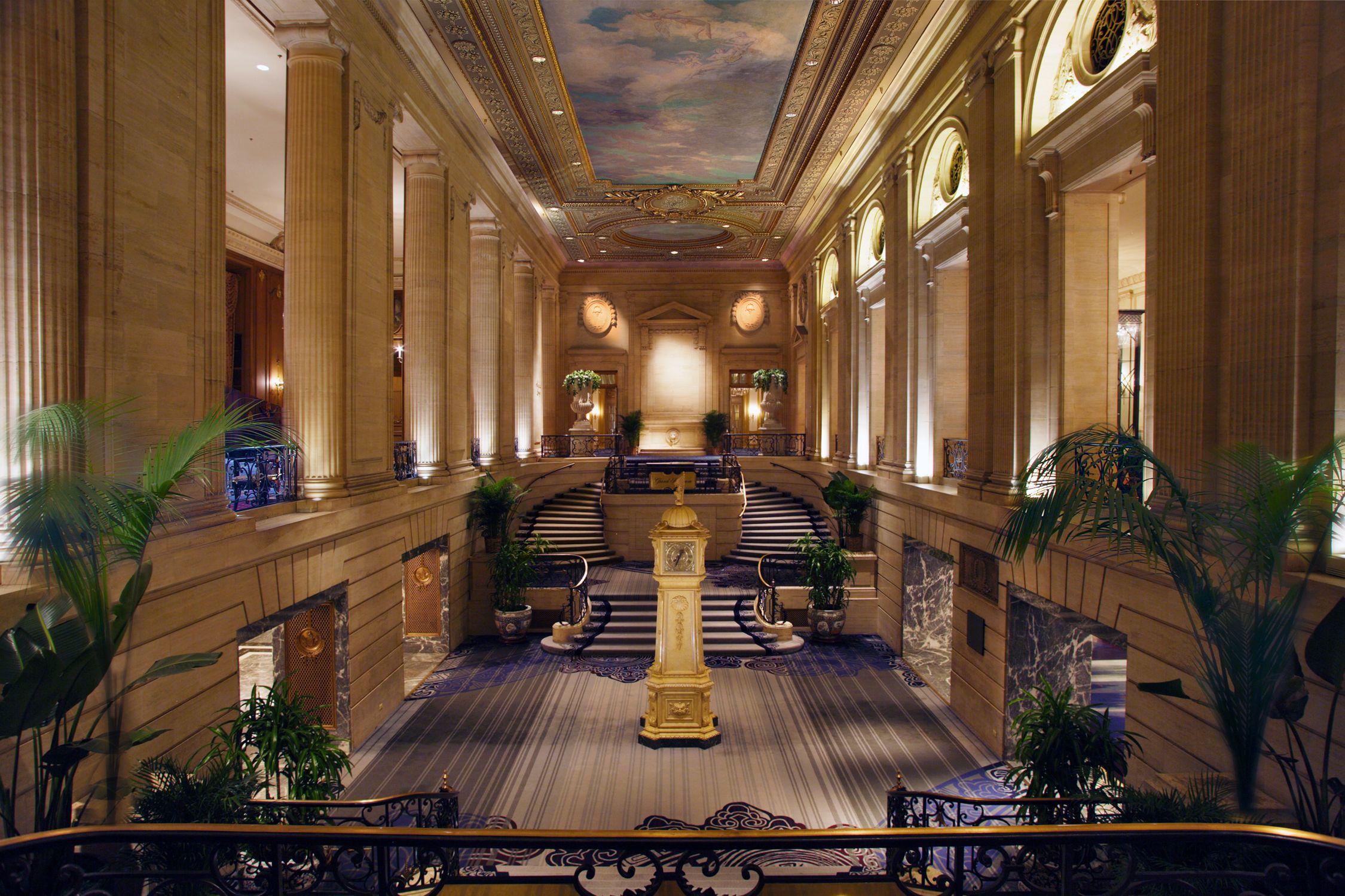 a large building with stairs and a clock