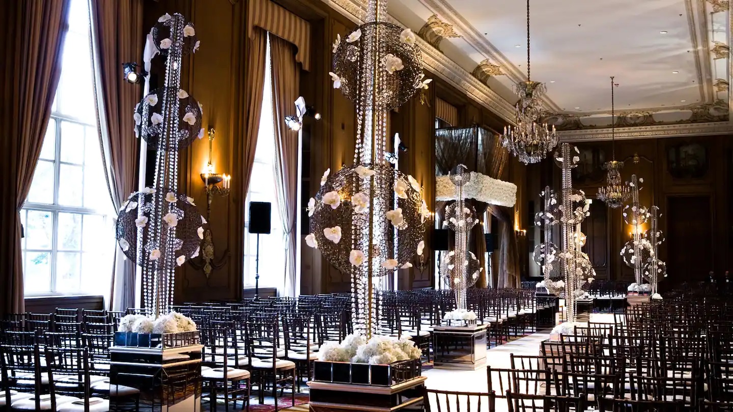 a room with chandeliers and chairs