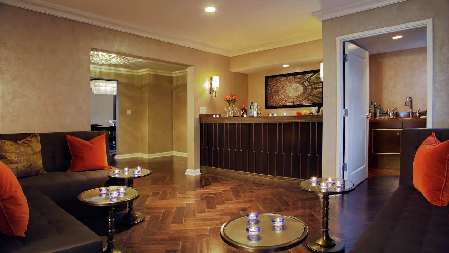 a room with a bar and a couch