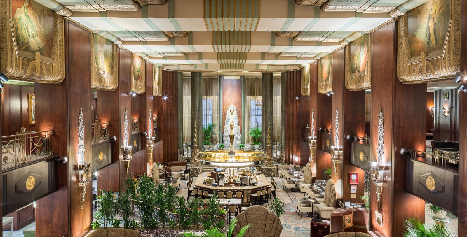 a room with a statue and tables