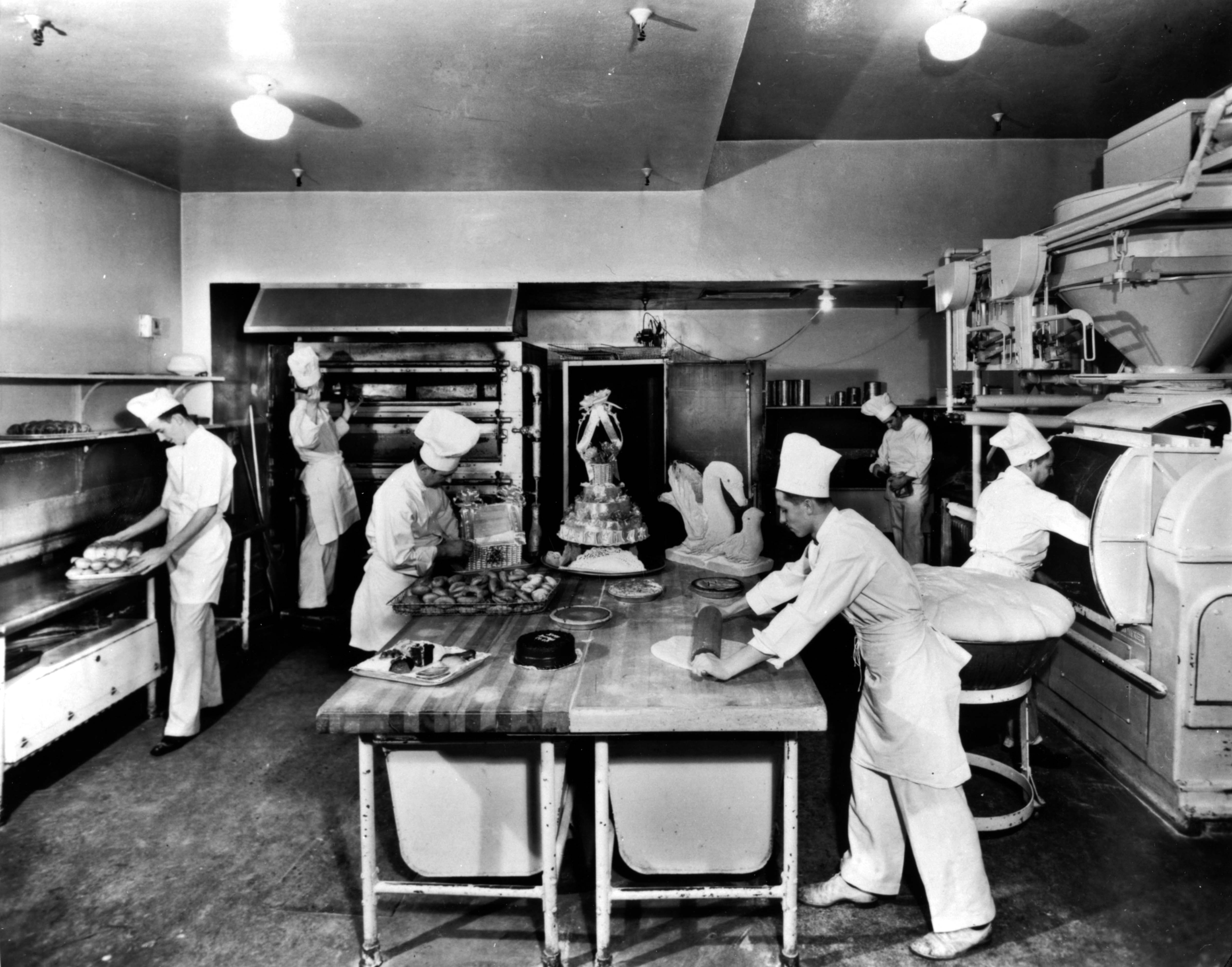 a group of chefs in a kitchen