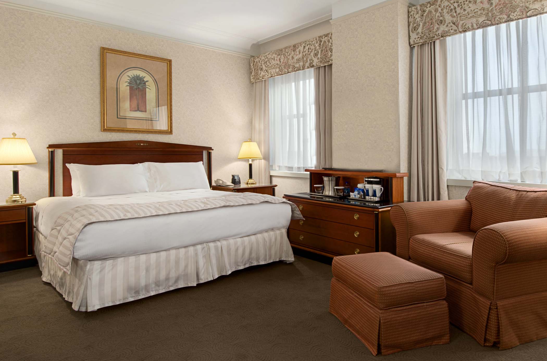 a bedroom with a bed and a chair