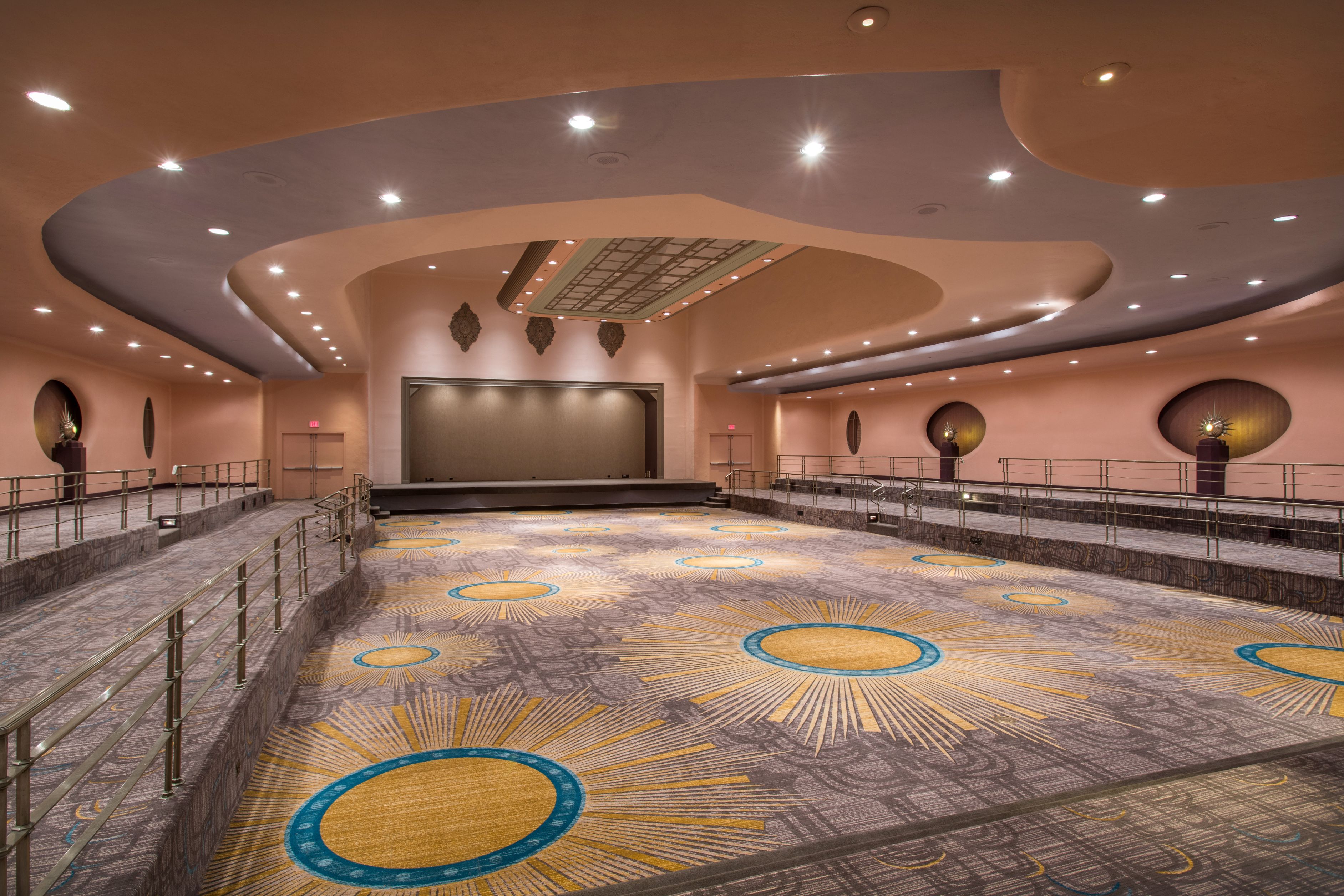 a large room with a stage and a stage