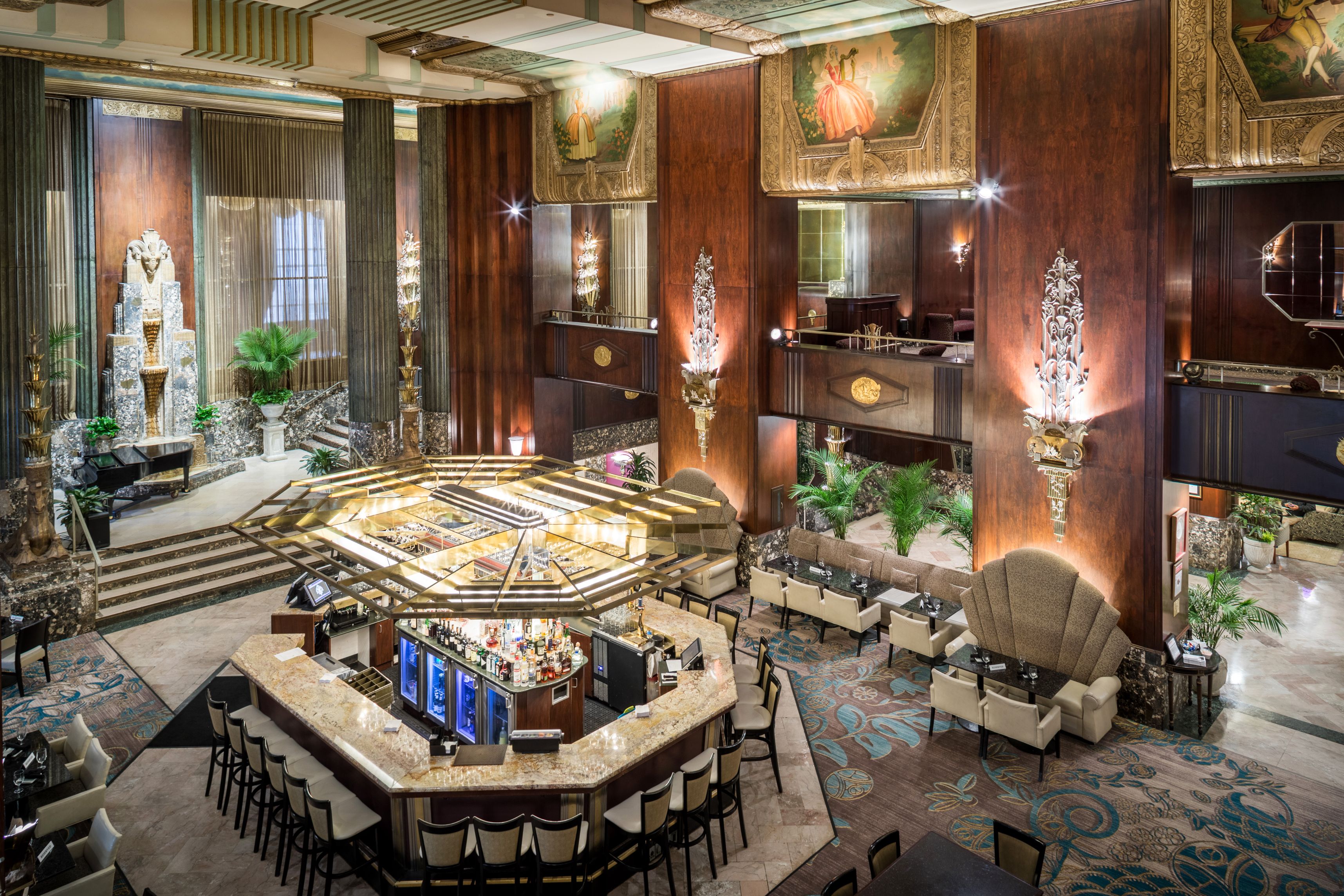 a large room with a bar and chairs