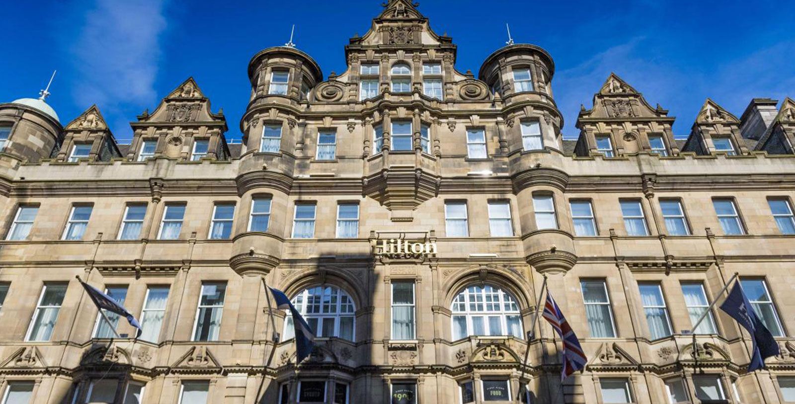 a building with flags on the front