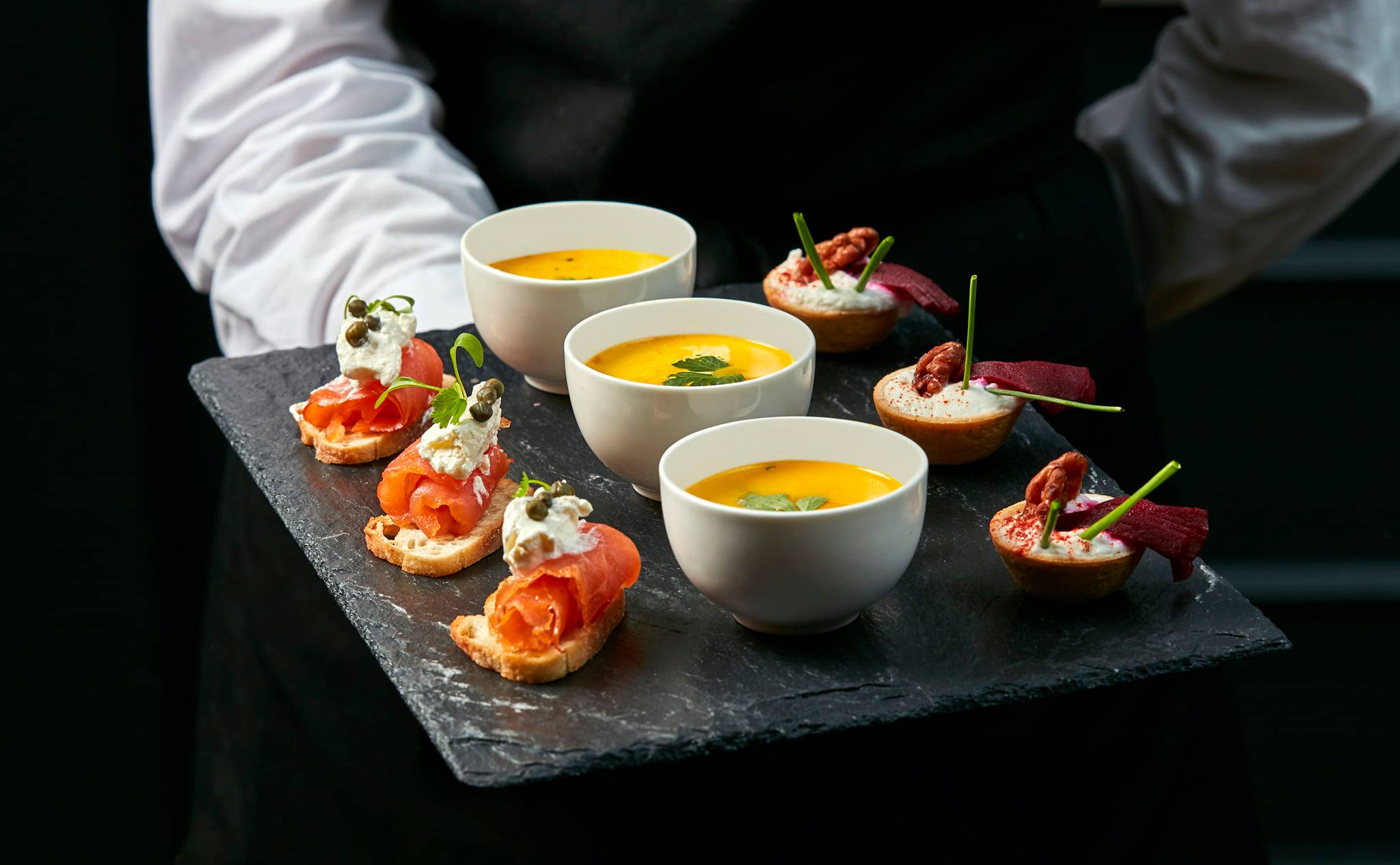 a tray of food on a black surface