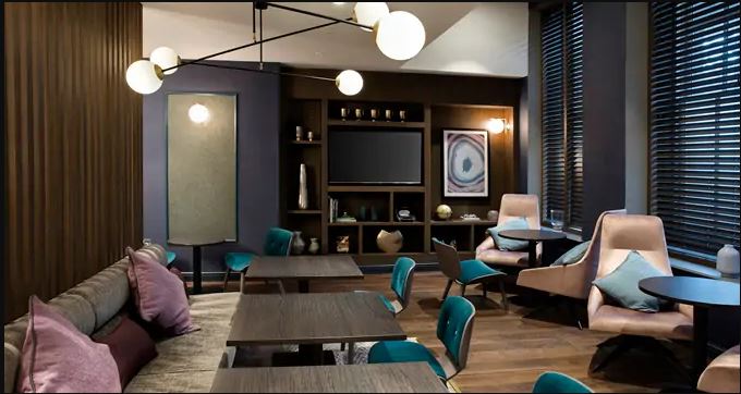a room with a tv and tables