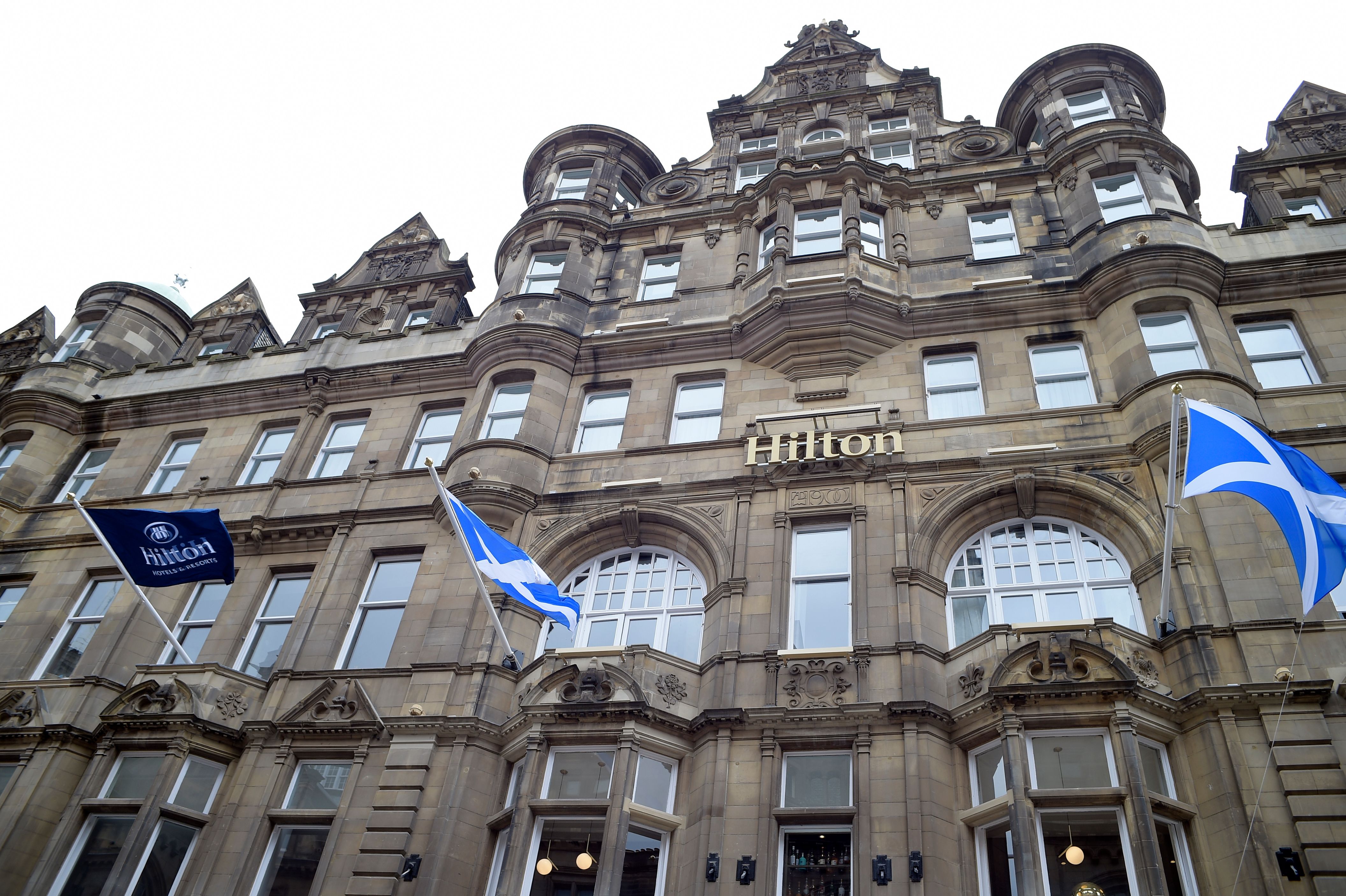 a building with flags on the front