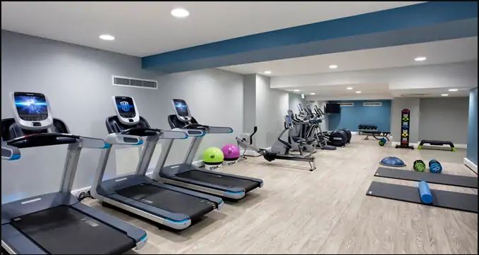 a room with treadmills and exercise equipment