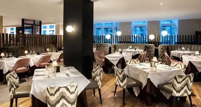 a restaurant with tables and chairs