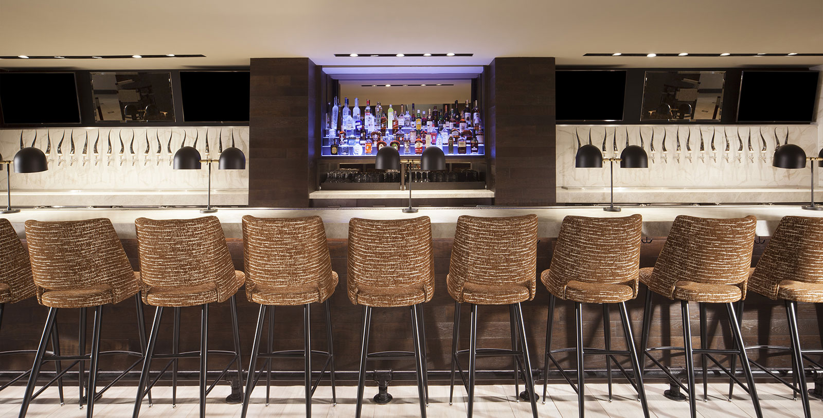 a row of chairs in a bar