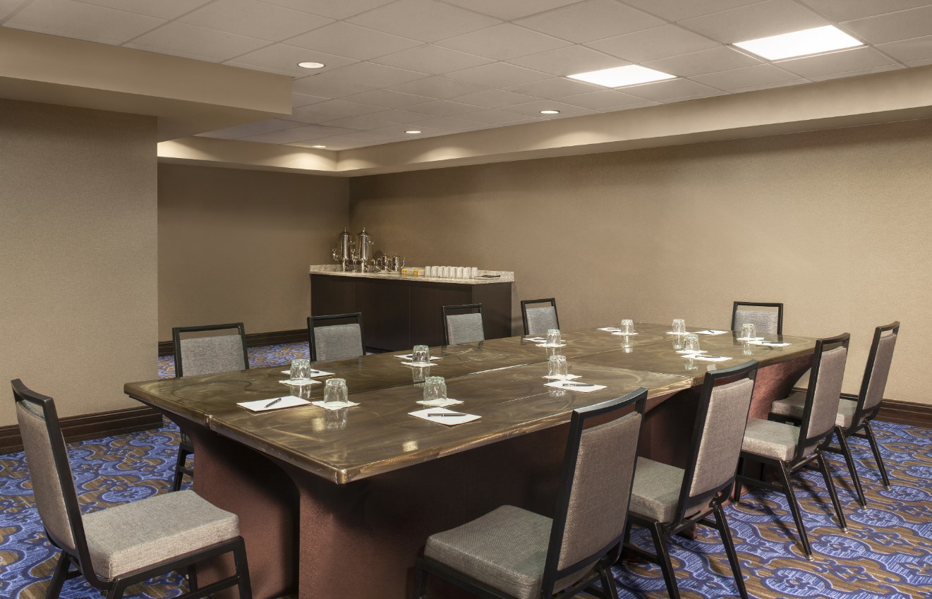a conference room with a table and chairs