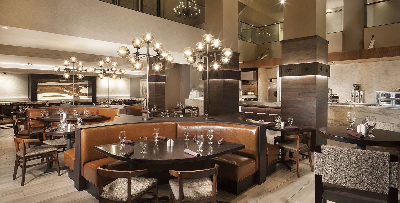 a restaurant with a chandelier and tables