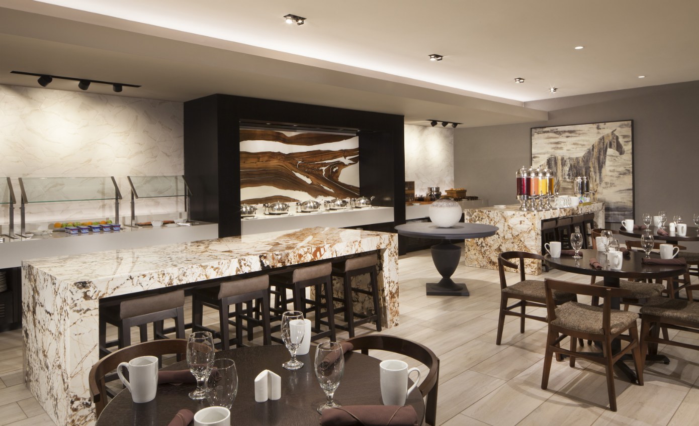 a restaurant with marble counter and chairs