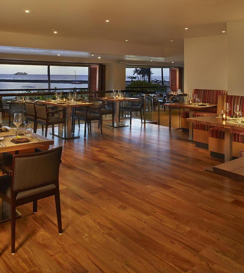 a restaurant with tables and chairs