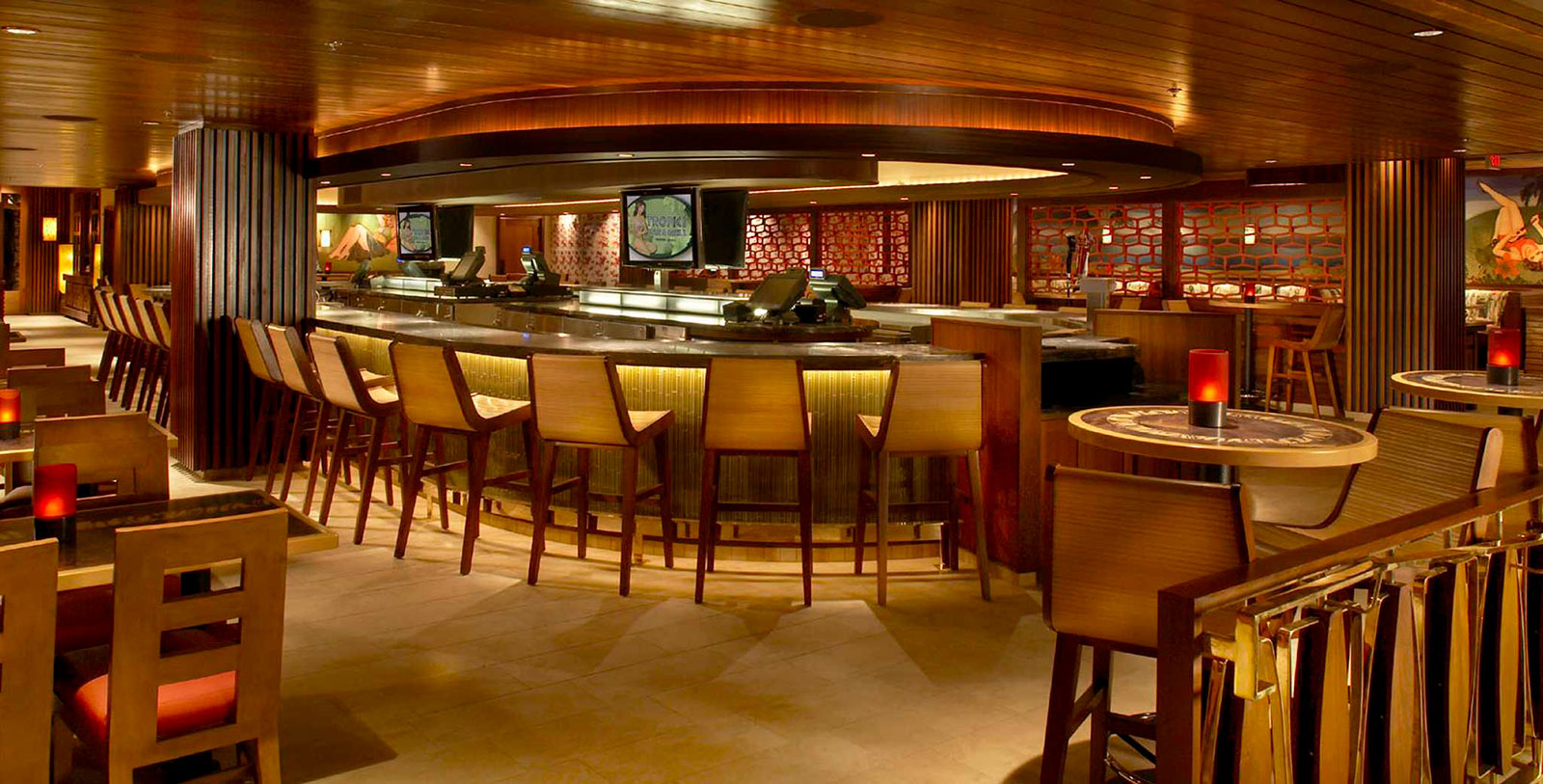 a bar with chairs and tables