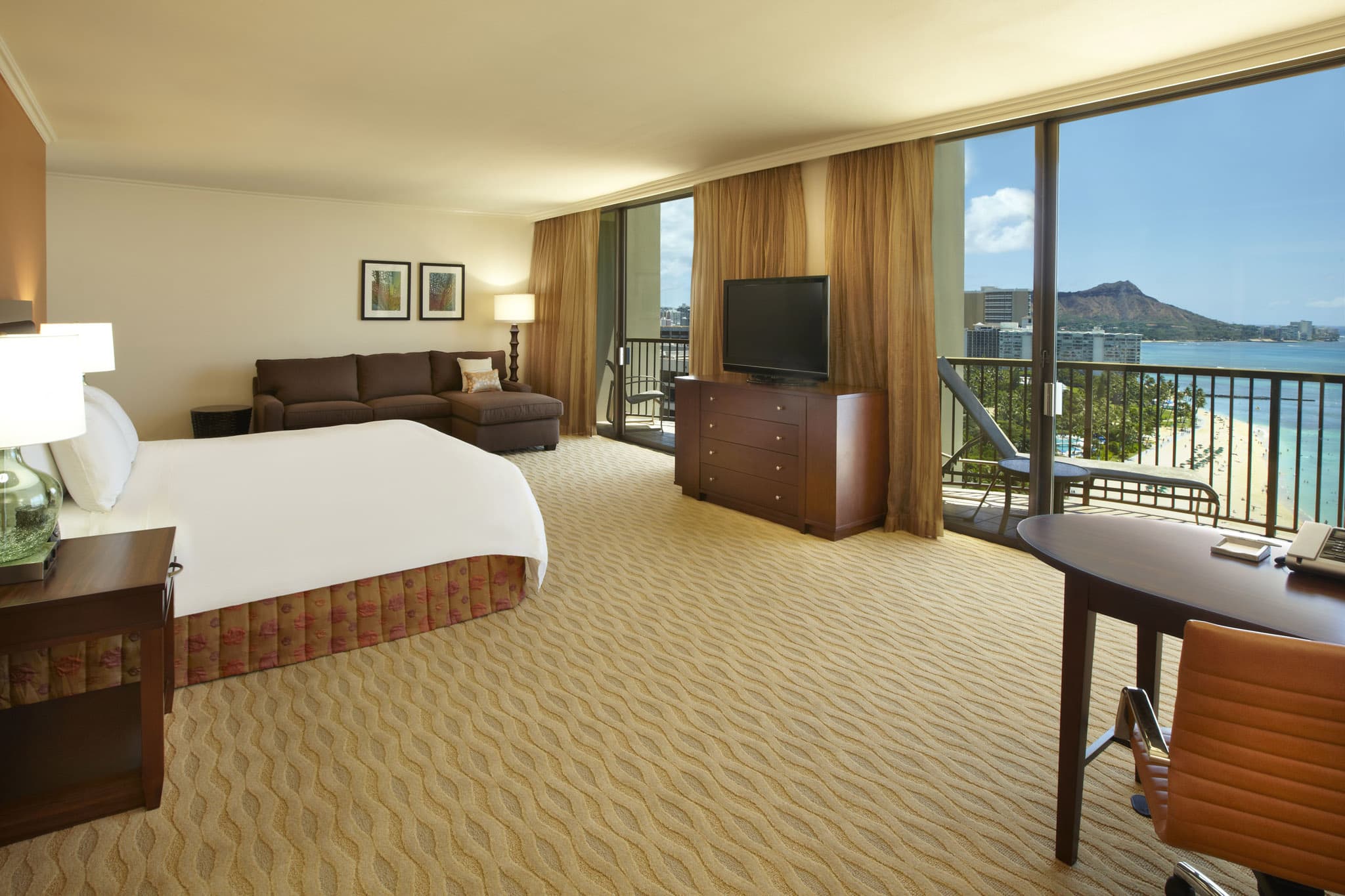 a hotel room with a television and a balcony