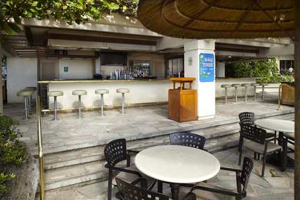 a table and chairs outside a bar