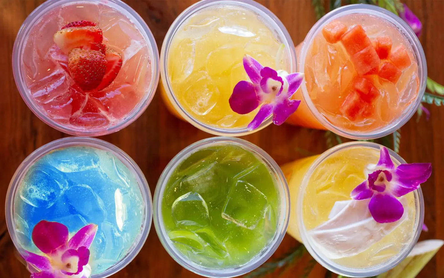 a group of drinks in plastic cups