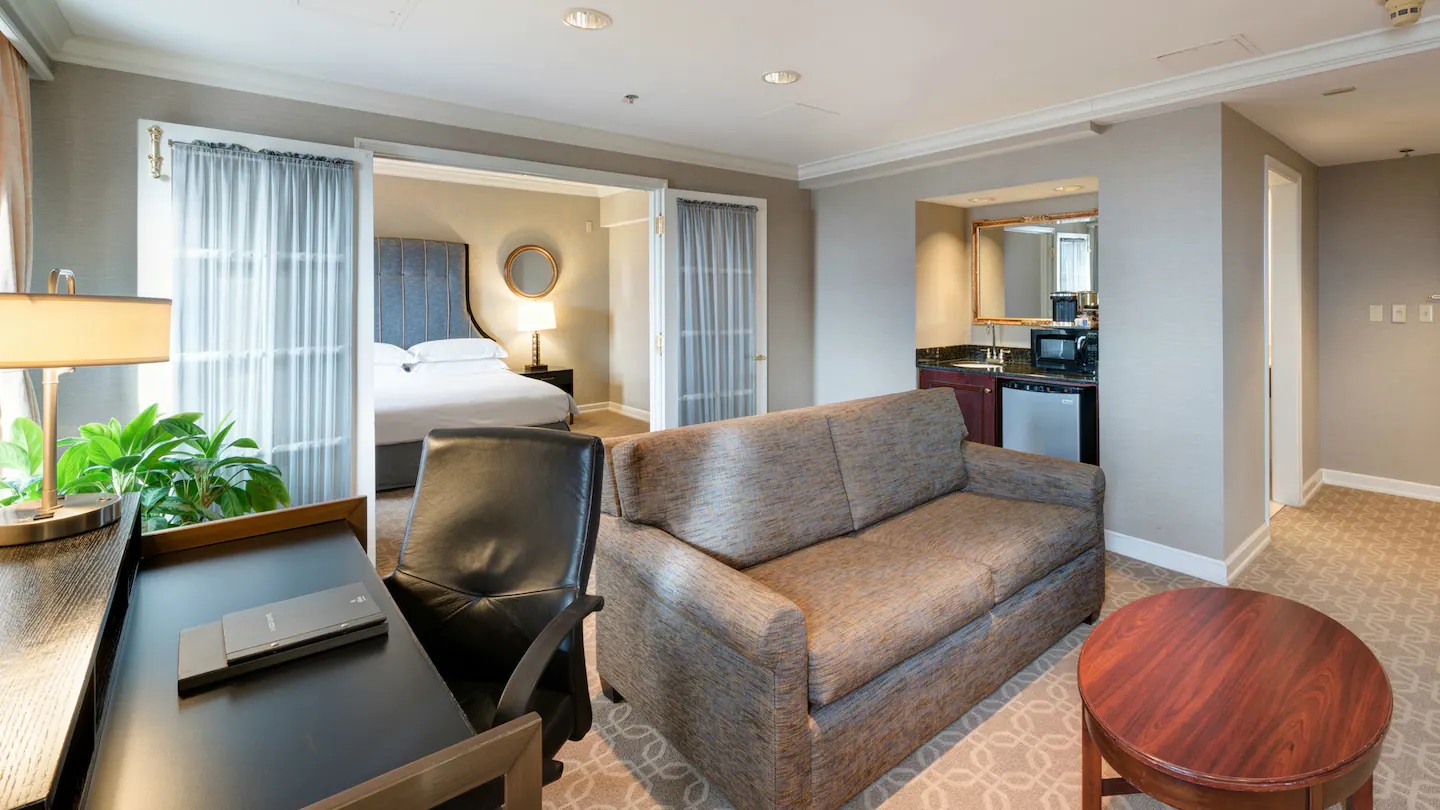 a room with a couch and a desk