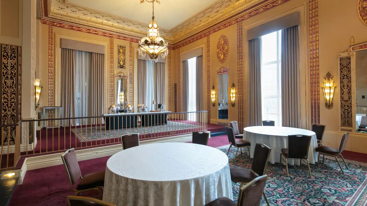 a room with tables and chairs