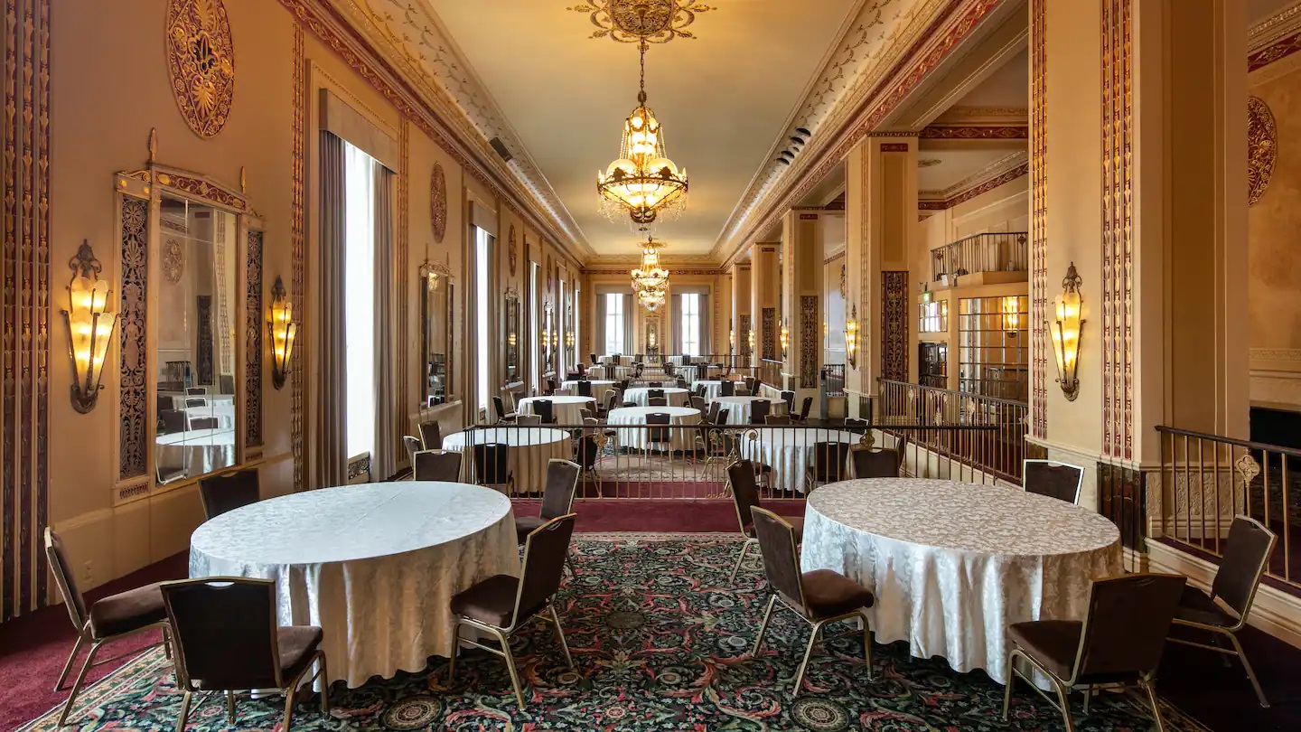 a room with tables and chairs