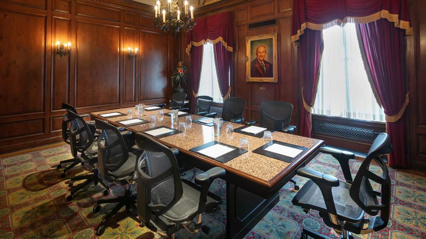 a room with a table and chairs