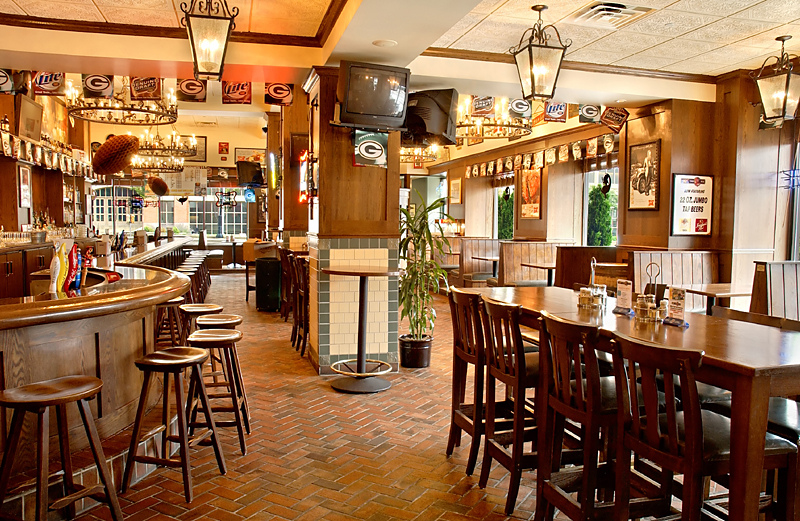 a bar with a table and chairs