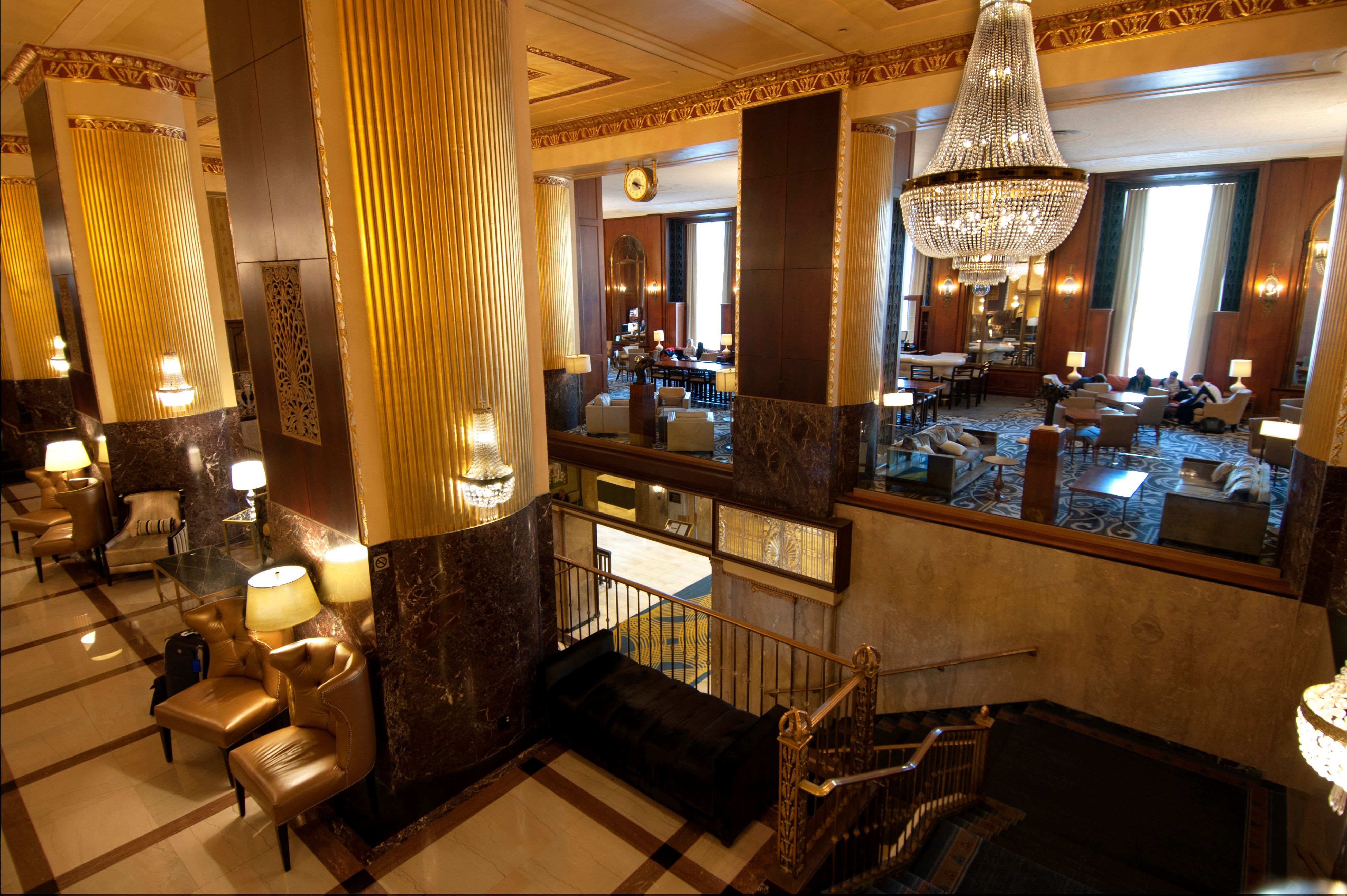 a large room with a chandelier and a staircase