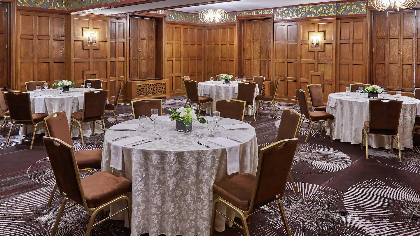 a room with round tables and chairs