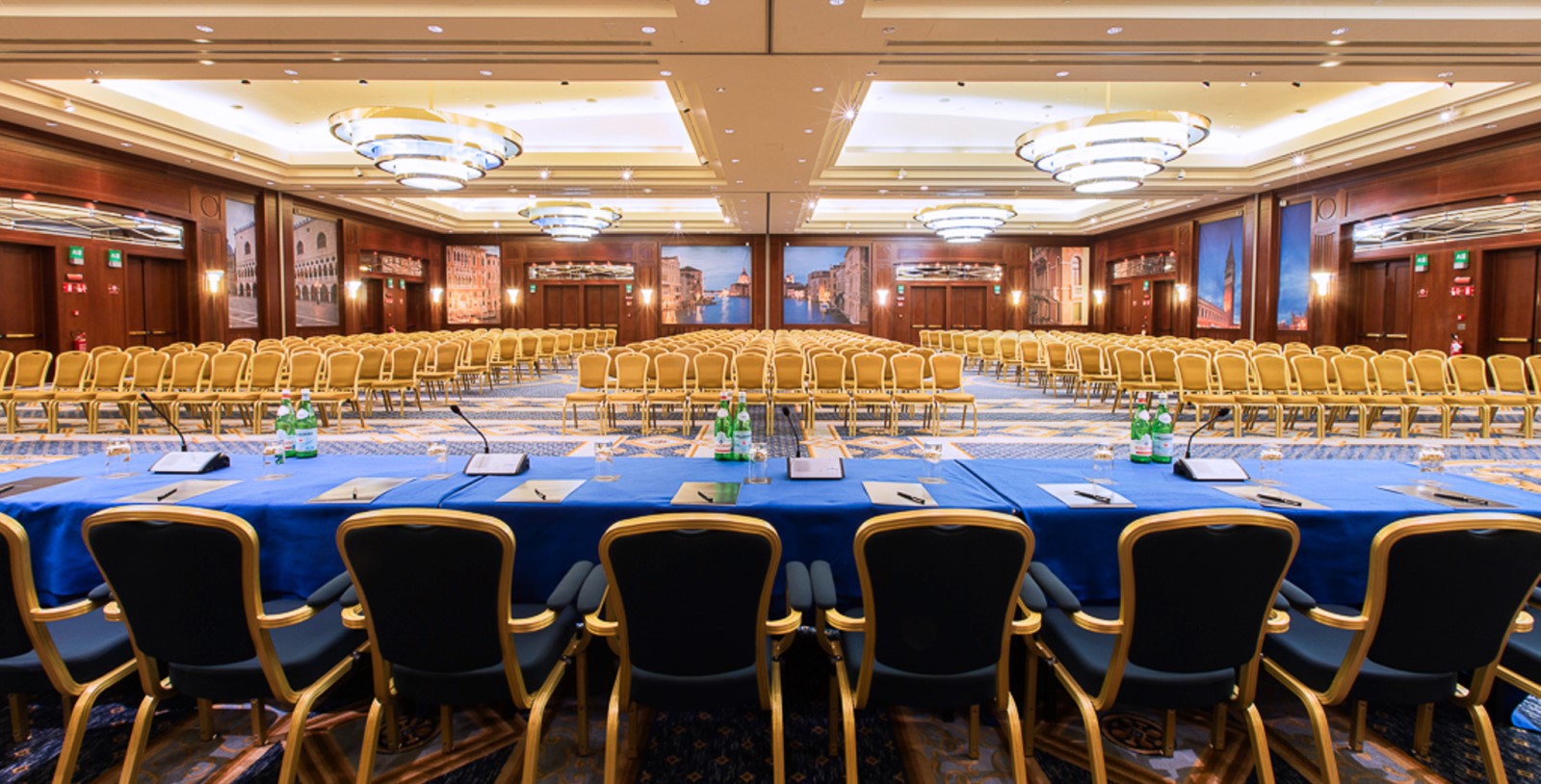 a room with a blue table and chairs