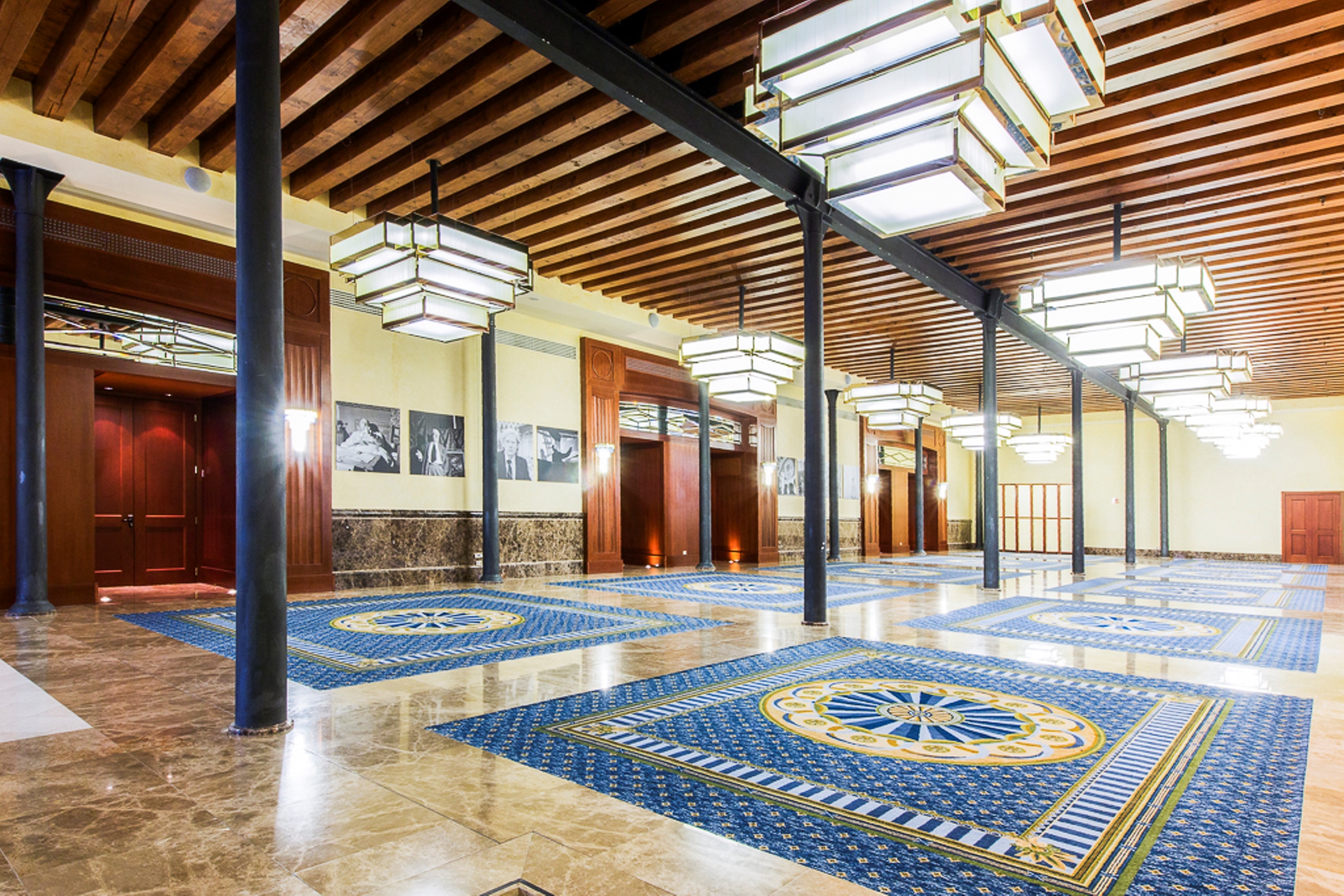 a large room with lights from the ceiling