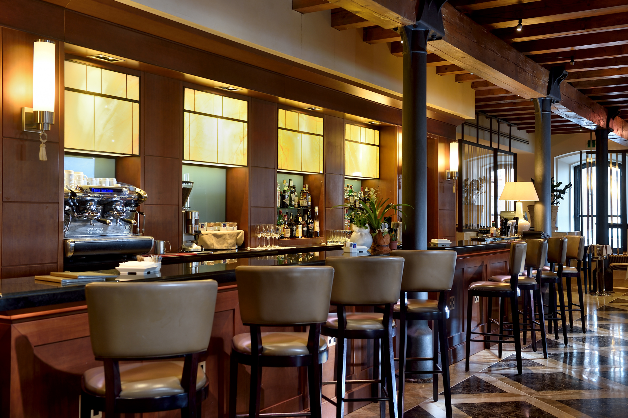 a bar with chairs and a table