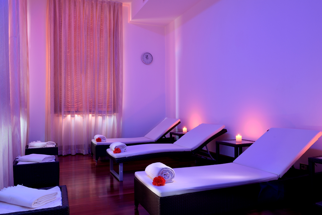 a room with lounge chairs and candles