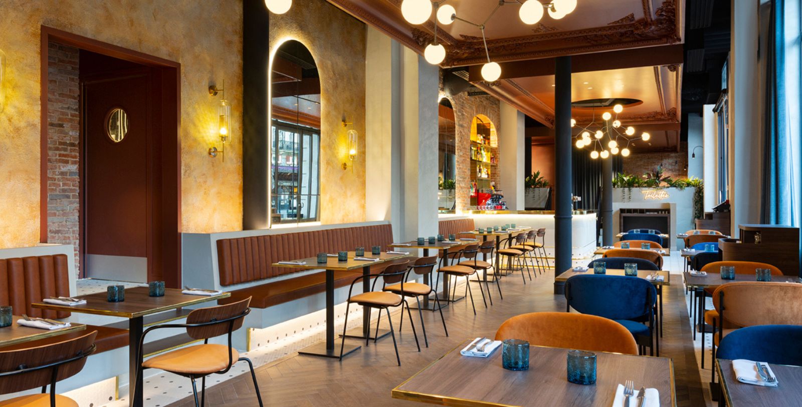 a restaurant with tables and chairs